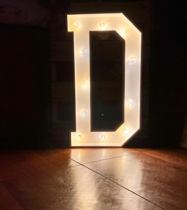 Marquee letter D